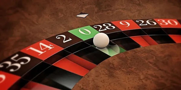 Roulette wheel spinning with chips placed on the betting table